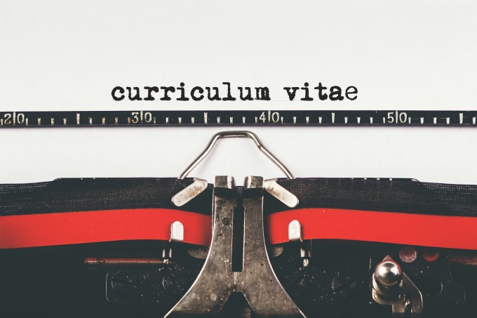 Curriculum Vitae type on old typewriter machine, vintage retro toned hipster style for job application, selective focus